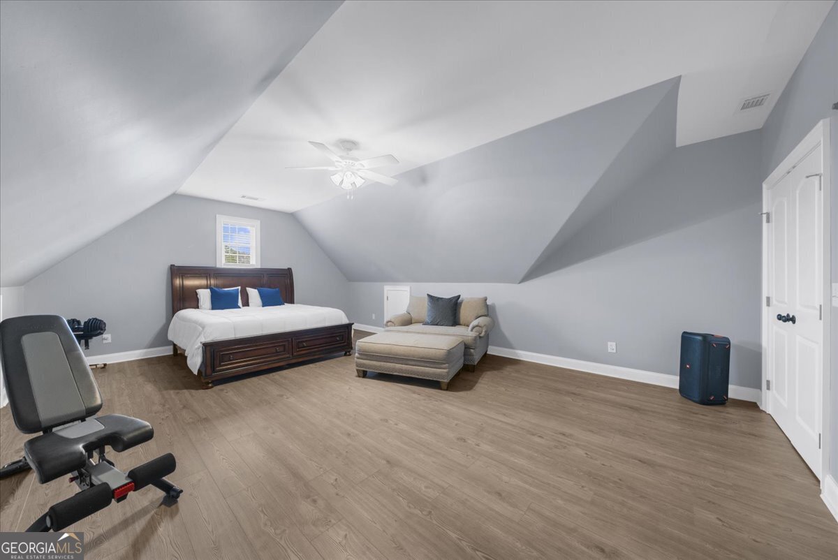 39 Fieldstone Drive Northeast Rome, GA 30161 - Photo 44 of 56 a bedroom with a bed and a chandelier