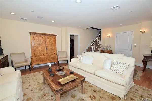 a living room with furniture rug and window