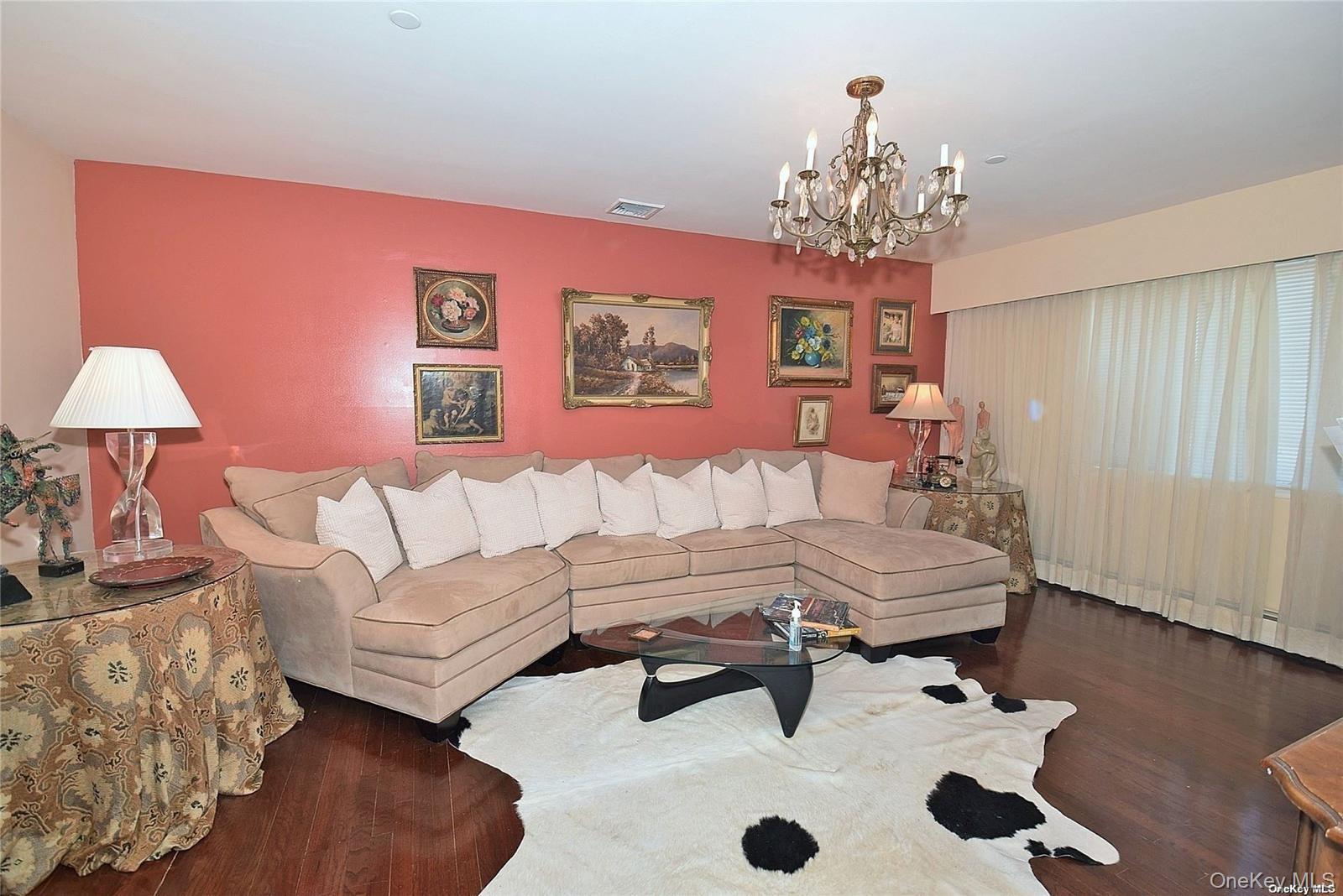 3434 Colony Drive Baldwin, NY 11510 - Photo 14 of 21 a living room with furniture and a chandelier