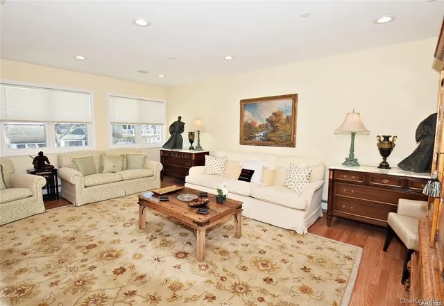 a living room with furniture and a rug