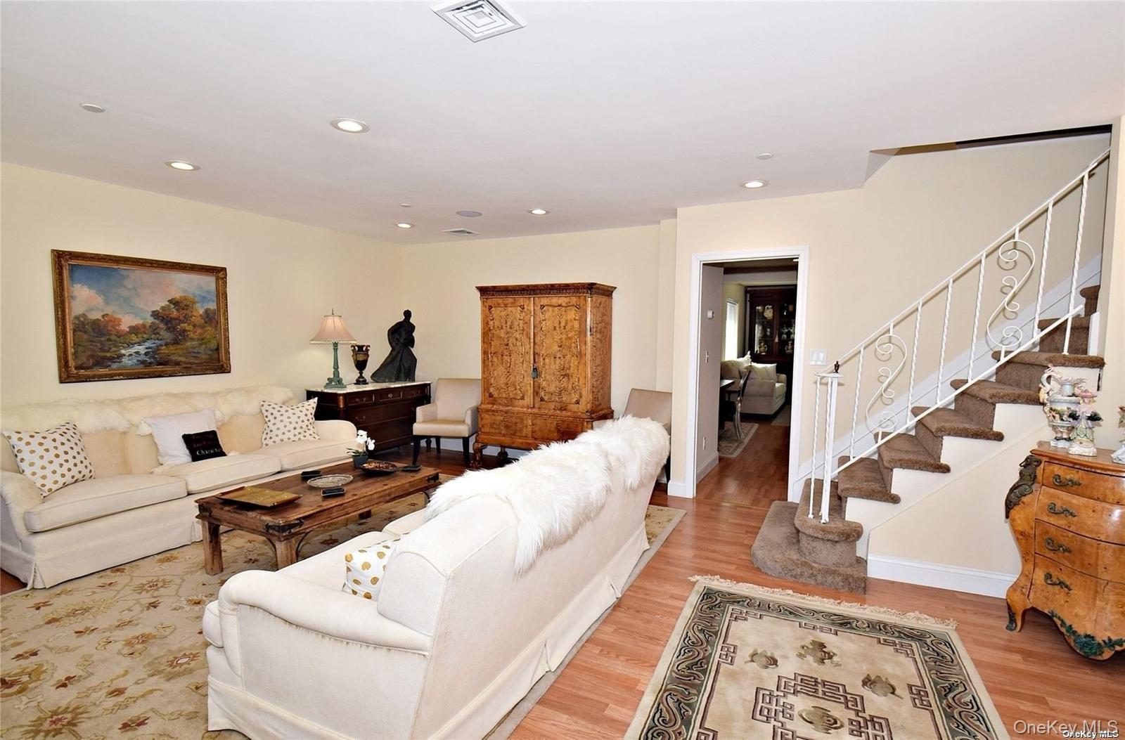3434 Colony Drive Baldwin, NY 11510 - Photo 21 of 21 a living room with furniture and wooden floor