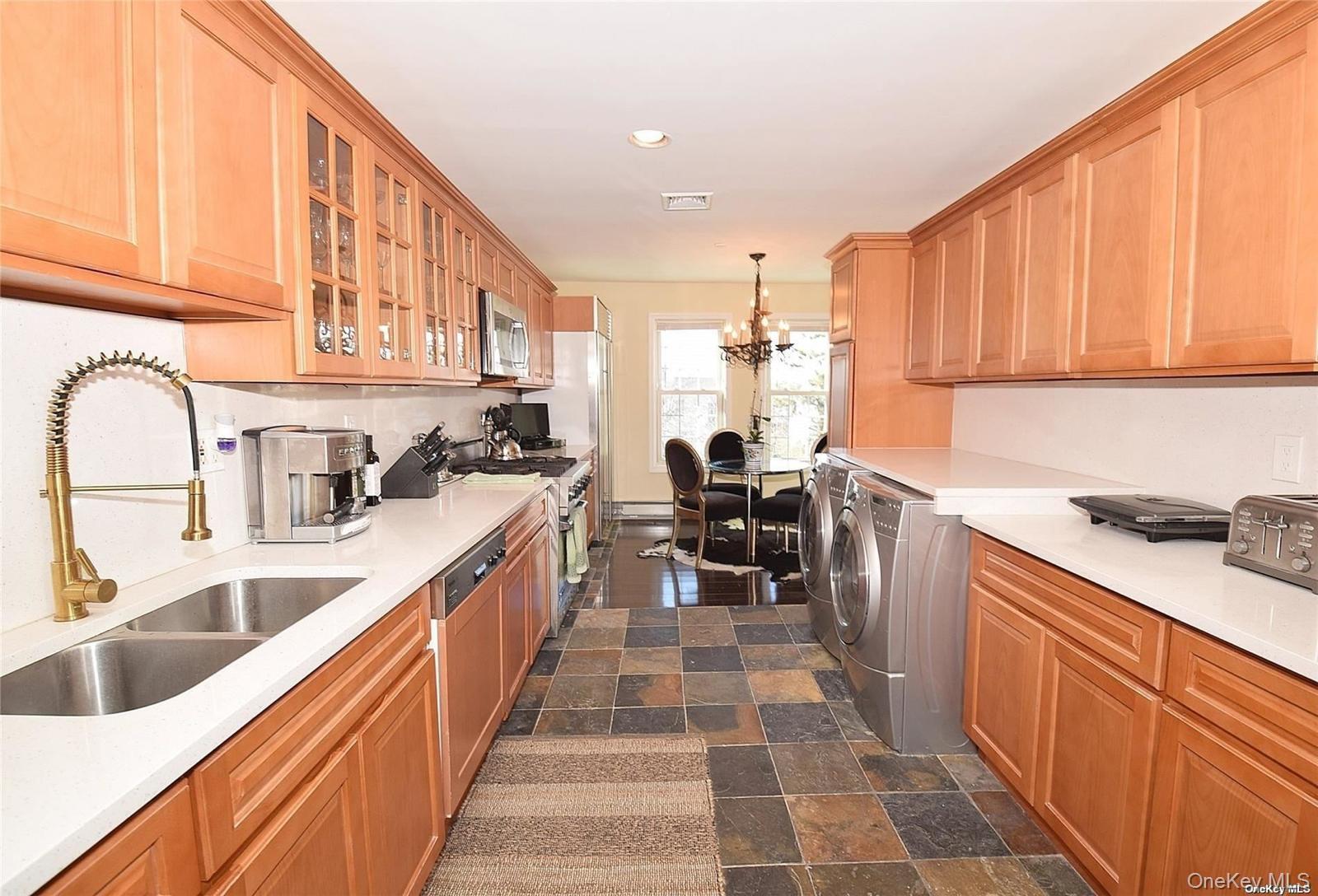 3434 Colony Drive Baldwin, NY 11510 - Photo 9 of 21 a kitchen with stainless steel appliances granite countertop a sink and cabinets