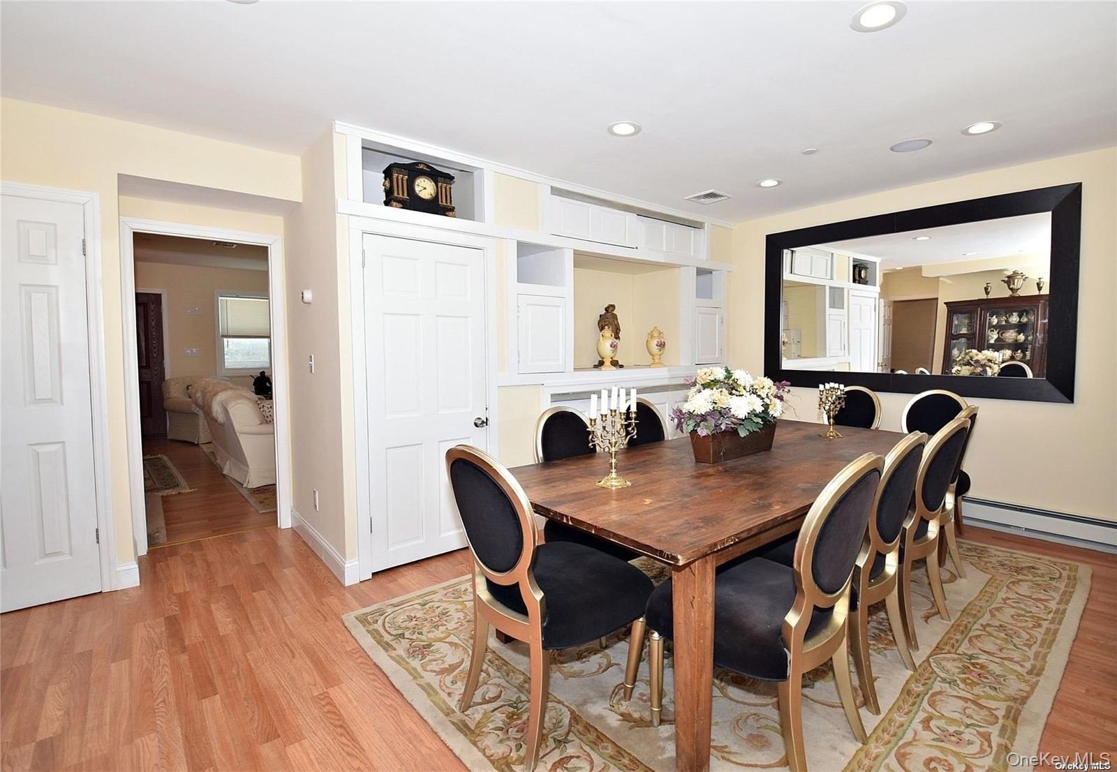 3434 Colony Drive Baldwin, NY 11510 - Photo 10 of 21 a view of a dining room with furniture and wooden floor