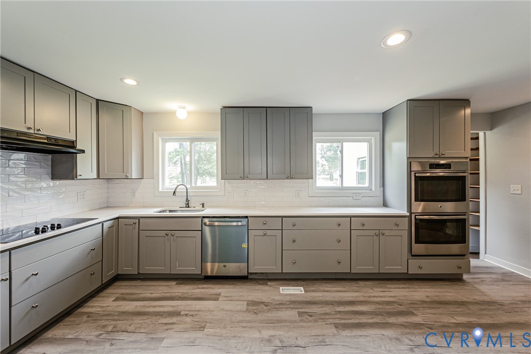 2015 Fordson Road Richmond, VA 23229 - Photo 12 of 48 Kitchen featuring light gray cabinetry, white coun