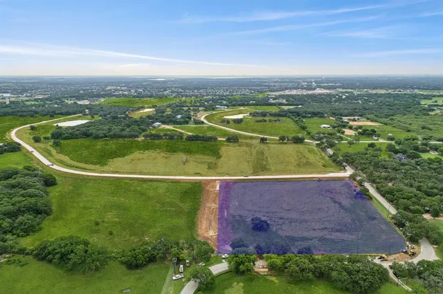 an aerial view of a houses with a outdoor space