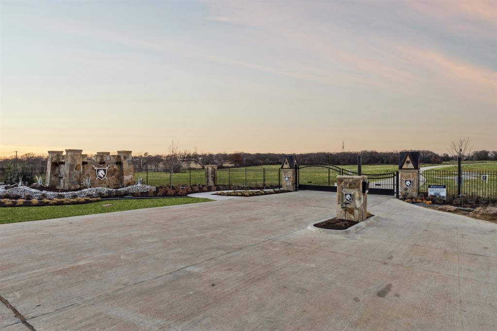 600 Wiesen Way Argyle, TX 76226 - Photo 7 of 40 a view of a road with a building and a big yard