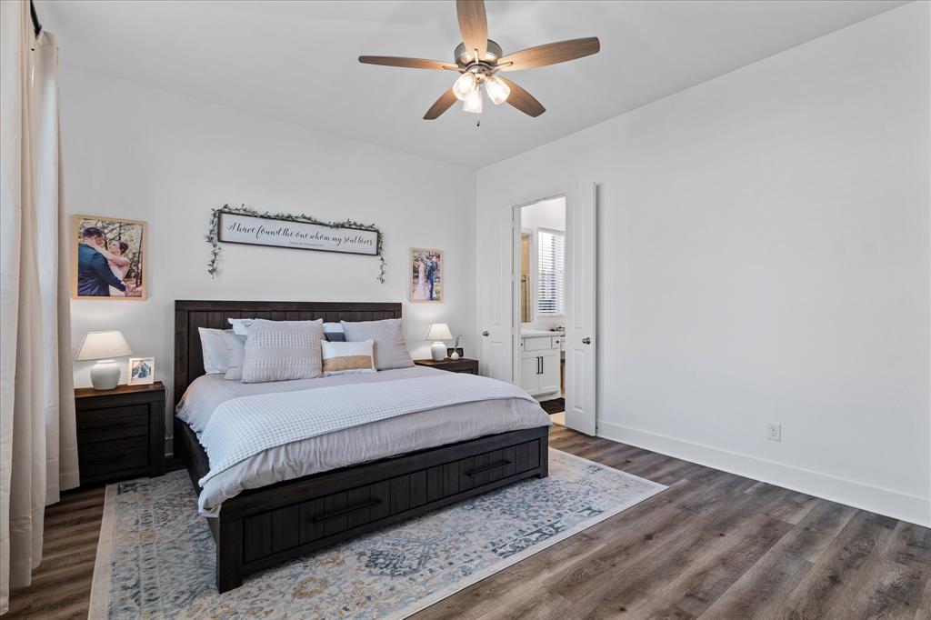 1332 Thompson Road Argyle, TX 76226 - Photo 14 of 36 Bedroom with a ceiling fan, dark wood finished floors, and connected bathroom