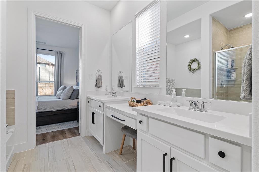 1332 Thompson Road Argyle, TX 76226 - Photo 16 of 36 Ensuite bathroom featuring double vanity, two vanities, and a shower stall