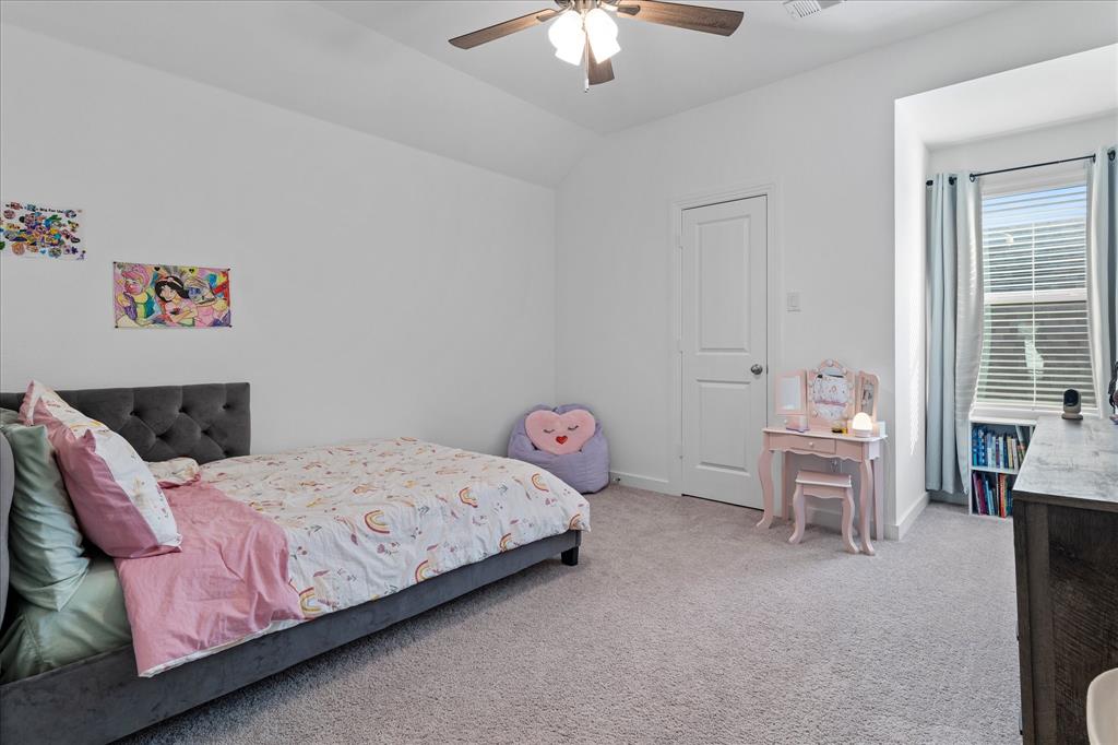 1332 Thompson Road Argyle, TX 76226 - Photo 25 of 36 Bedroom with light colored carpet, lofted ceiling, and a ceiling fan