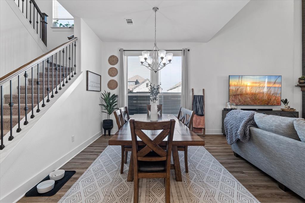 1332 Thompson Road Argyle, TX 76226 - Photo 5 of 36 Dining room with healthy amount of natural light, dark wood finished floors, and suspended lighting