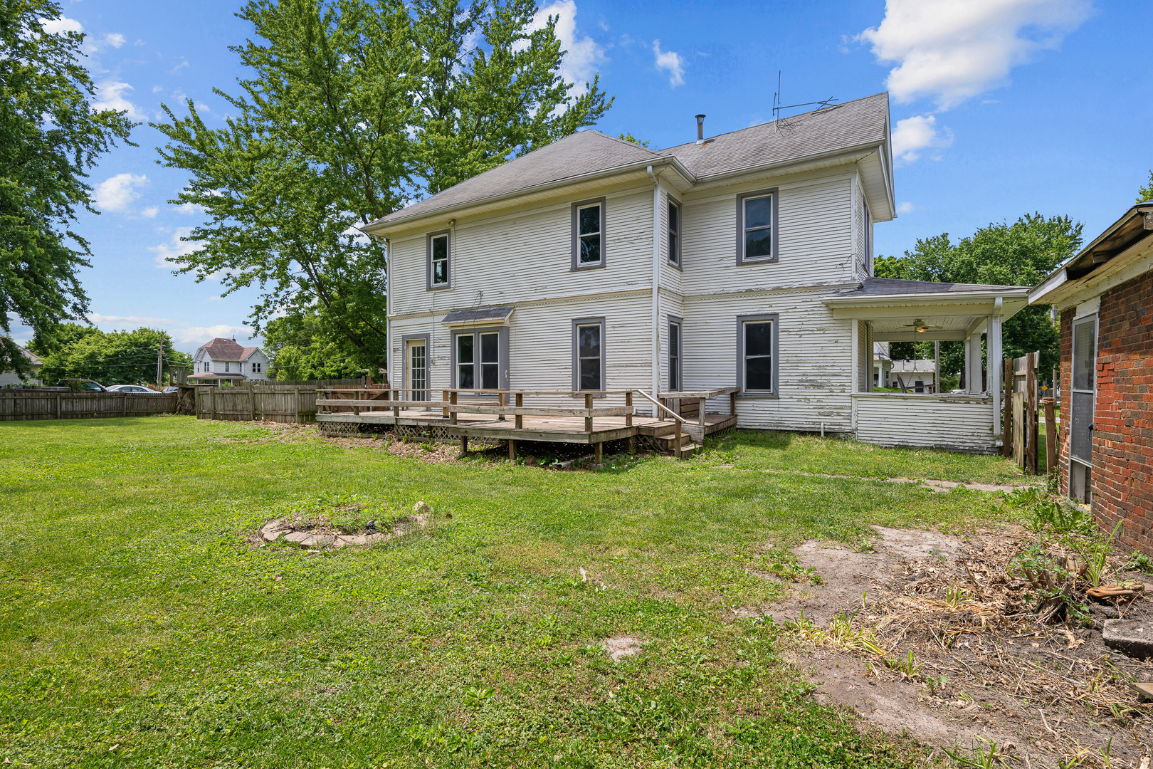 1202 20th Avenue Viola, IL 61486 - Photo 4 of 50 a view of a house with a backyard porch and sitting area