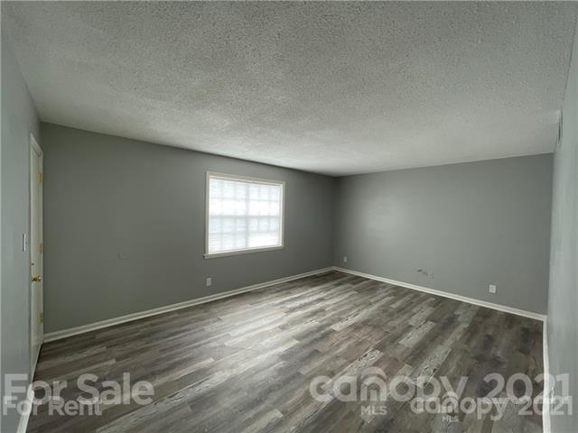 5805 Hunting Ridge Lane, Unit A Charlotte, NC 28212 - Photo 2 of 4 a view of an empty room and window