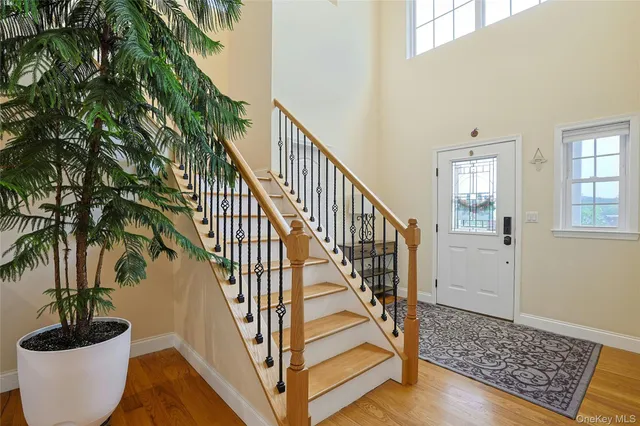 a view of entryway with wooden floor and a potted plant
