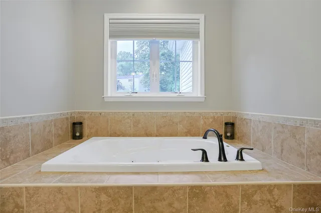 a bathroom with a sink double vanity and a mirror