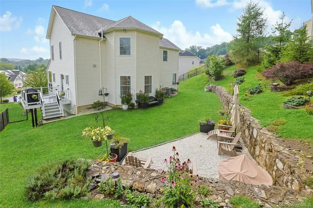 a view of a garden with a building in the background