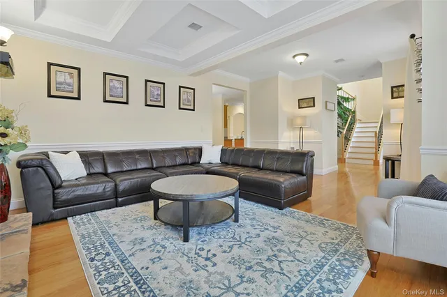 a living room with furniture and a rug