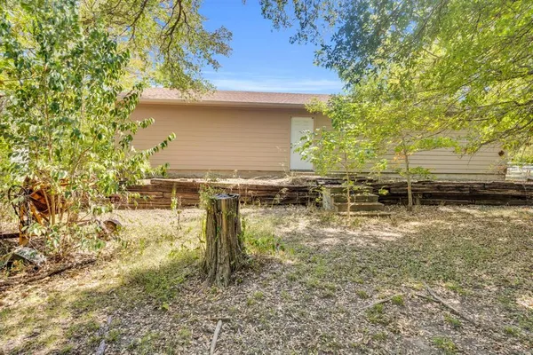 a backyard of a house with lots of green space