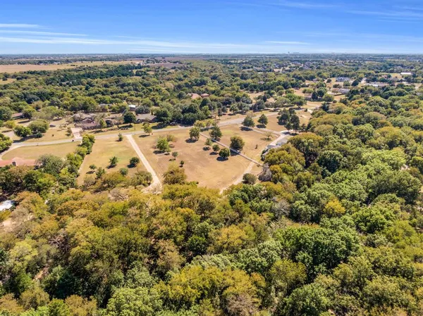 an aerial view of residential building with parking space