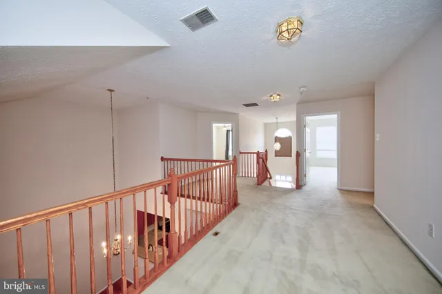 a view of a hallway with a window