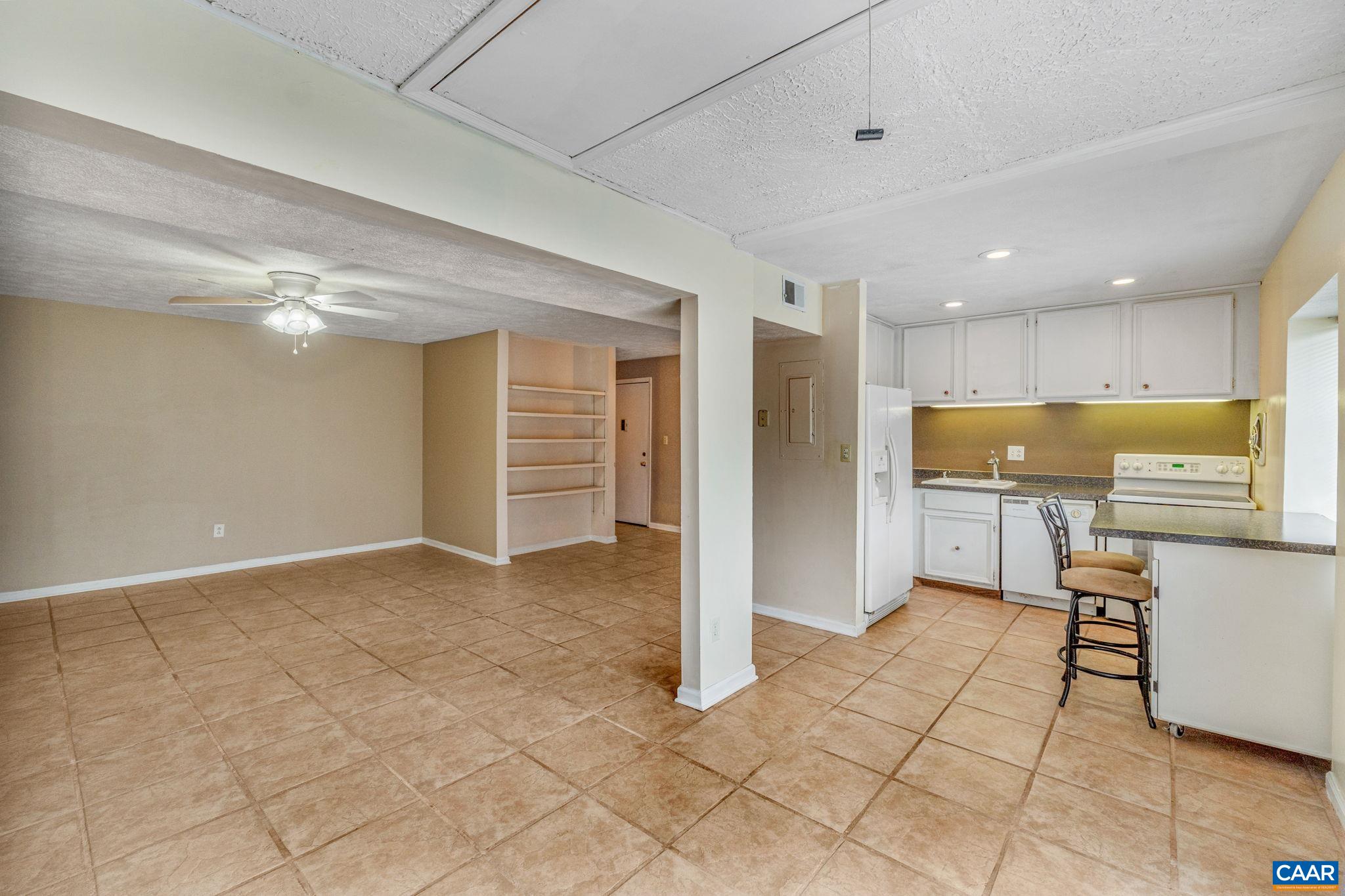 33 Spring Court Charlottesville, VA 22901 - Photo 11 of 26 a view of a kitchen with refrigerator and chairs