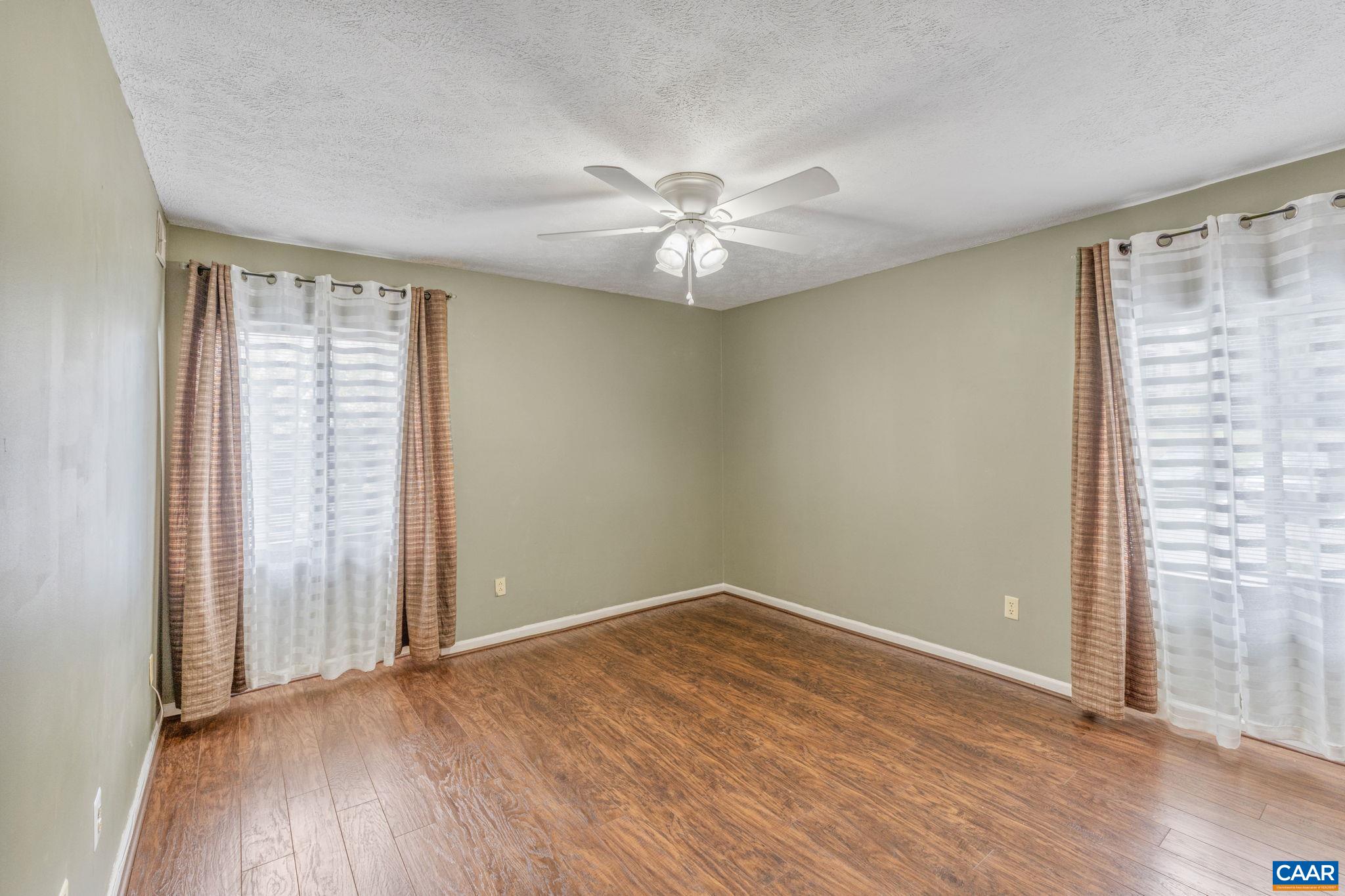 33 Spring Court Charlottesville, VA 22901 - Photo 19 of 26 an empty room with wooden floor and windows