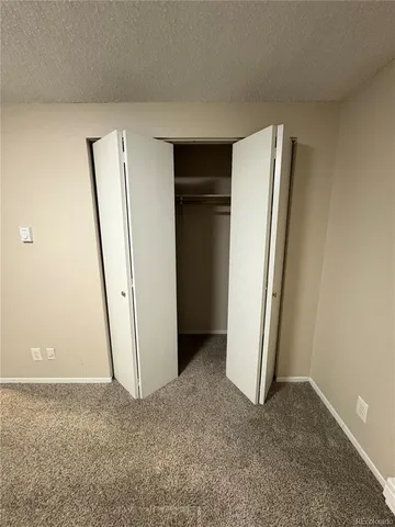 an empty room with closet