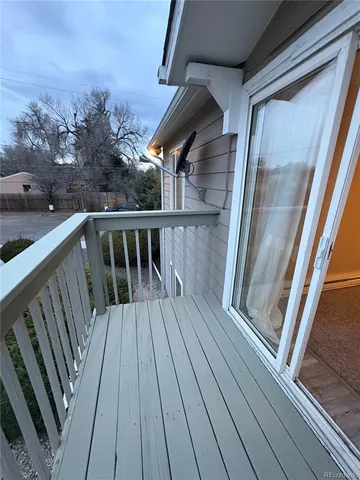 a view of balcony with wooden floor