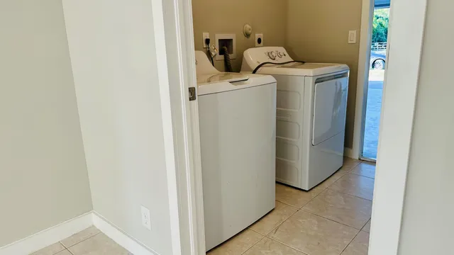 a utility room with dryer and washer