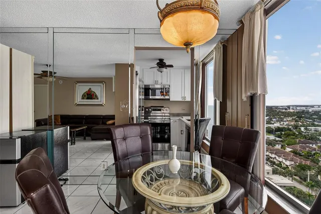 a kitchen with stainless steel appliances a stove sink microwave and cabinets