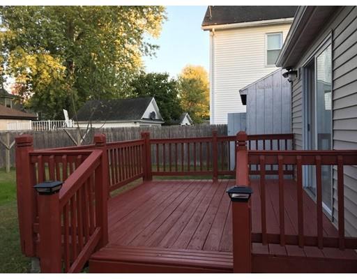 91 Windemere Street Springfield, MA 01104 - Photo 20 of 28 a view of a deck with wooden floor and fence