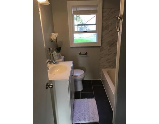 91 Windemere Street Springfield, MA 01104 - Photo 10 of 28 a bathroom with a sink toilet and a mirror