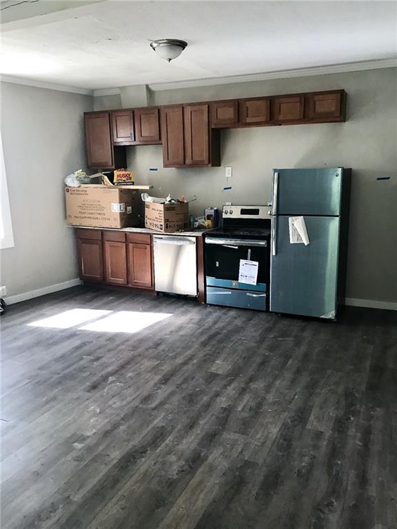 473 Wall Avenue, Unit B Wall, PA 15148 - Photo 2 of 6 a kitchen with stainless steel appliances granite countertop a stove a sink and a refrigerator