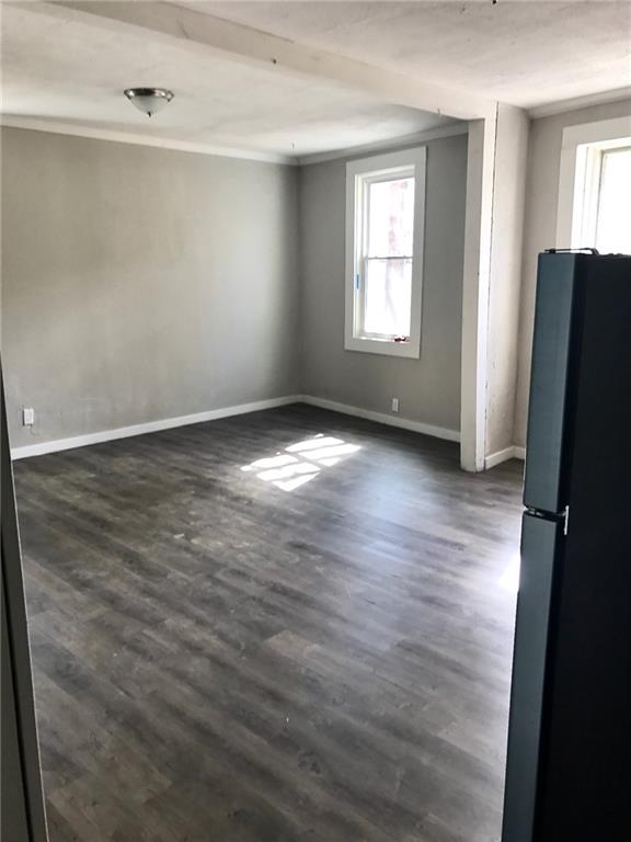 473 Wall Avenue, Unit B Wall, PA 15148 - Photo 3 of 6 an empty room with wooden floor and windows