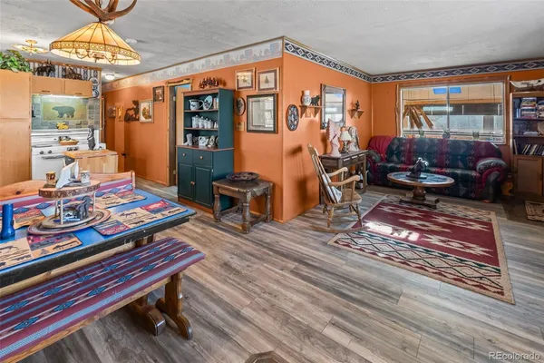 a living room filled with furniture and a table