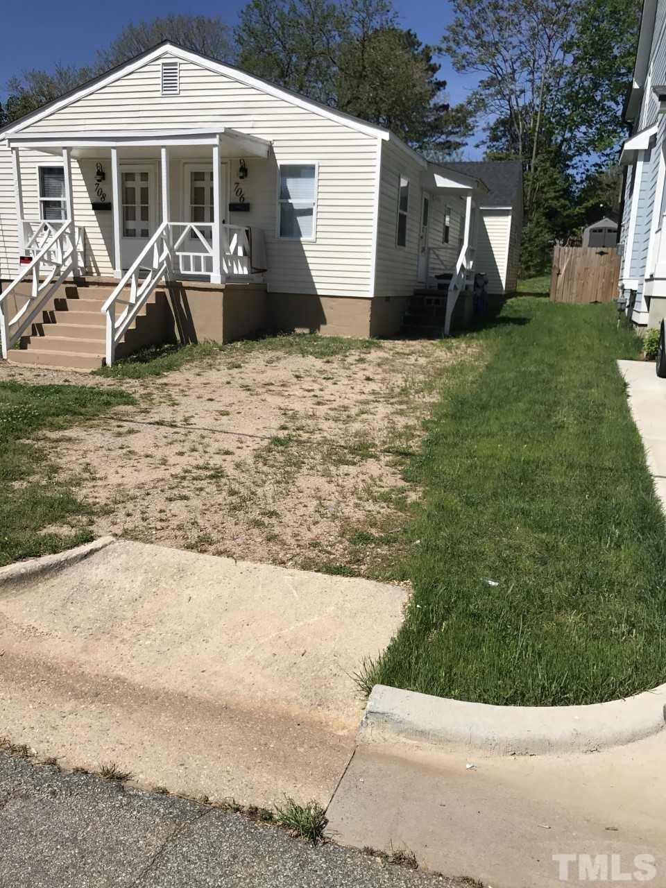 a view of a house with backyard porch and sitting area