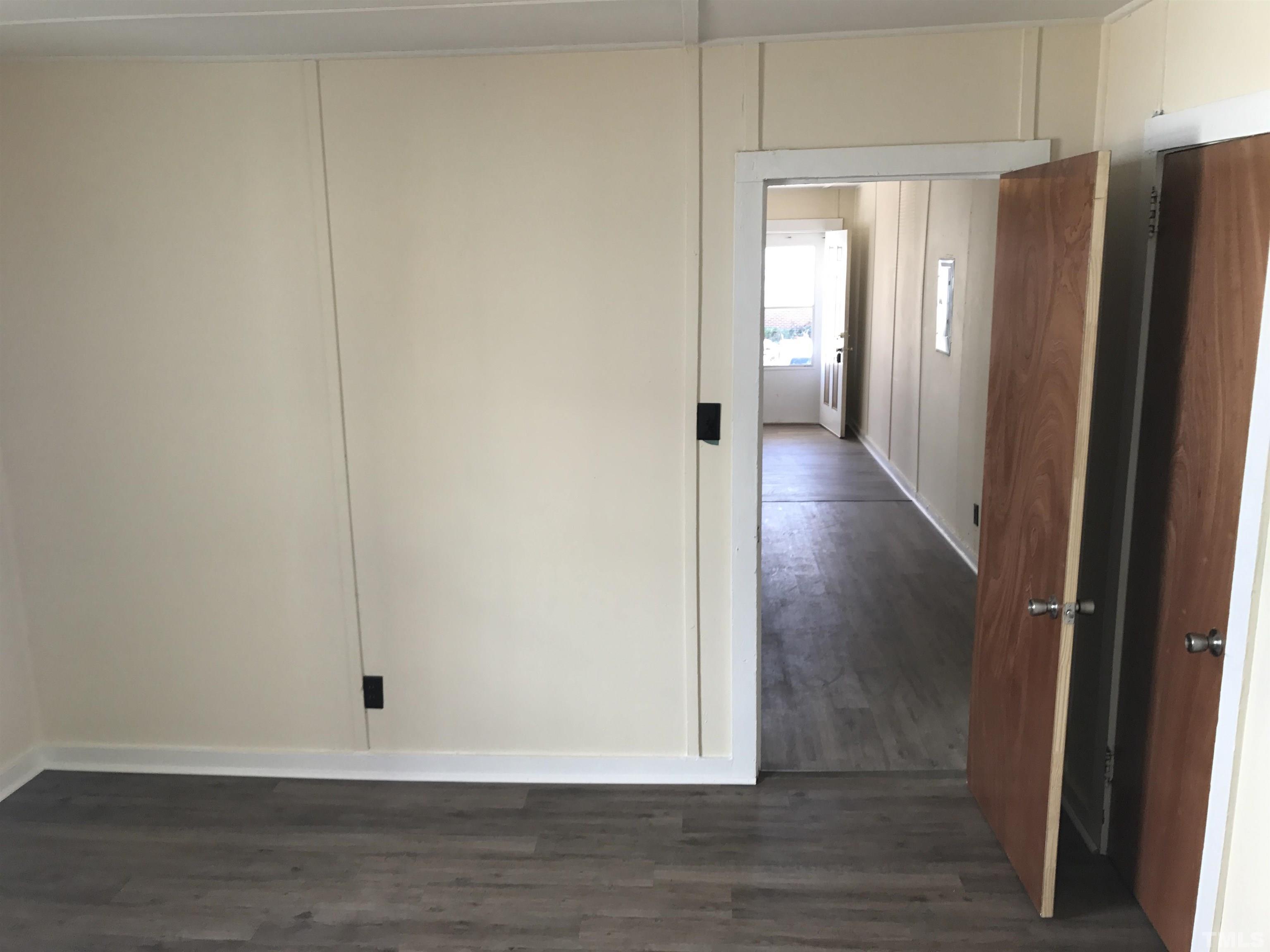 706 Coleman Street Raleigh, NC 27610 - Photo 5 of 5 a view of a hallway with wooden floor