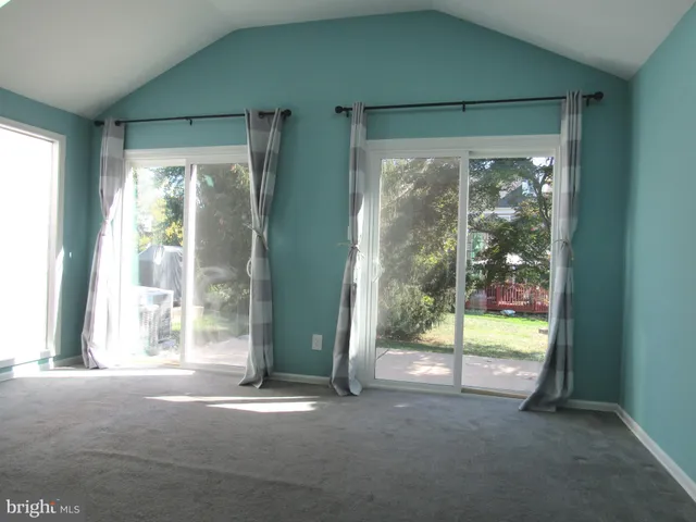 a view of empty room with floor to ceiling window