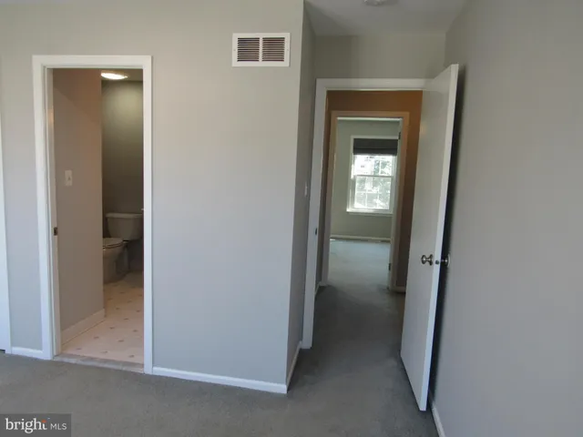 a view of a livingroom from a hallway