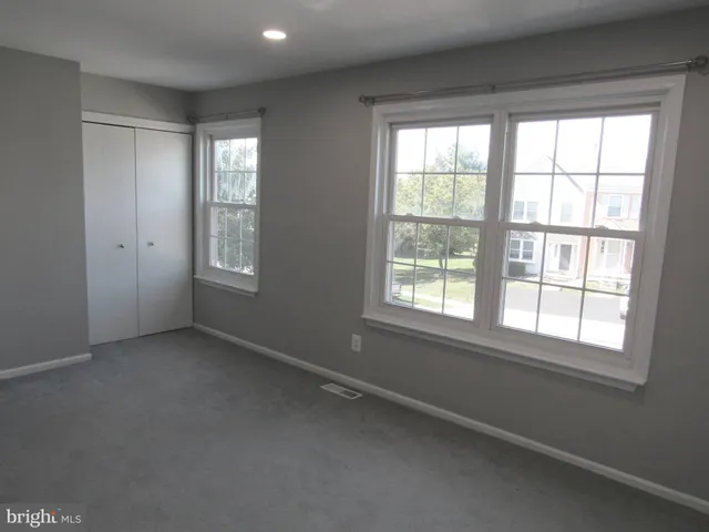 a white toilet sitting next to a shower curtain