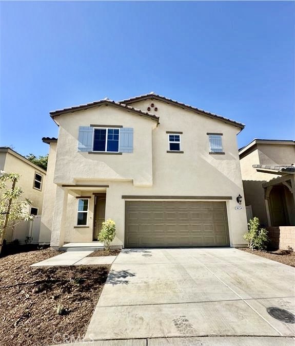 34254 Summer Lane Yucaipa, CA 92399 - Photo 1 of 2 a front view of a house with a yard