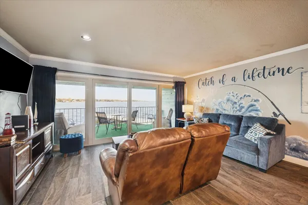 a living room with furniture fireplace and flat screen tv
