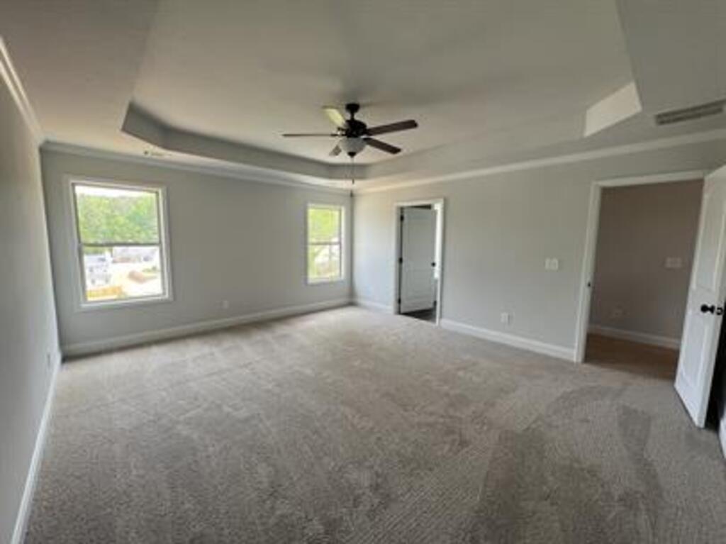 1389 River Mist Circle Jefferson, GA 30549 - Photo 10 of 18 an empty room with windows and fan
