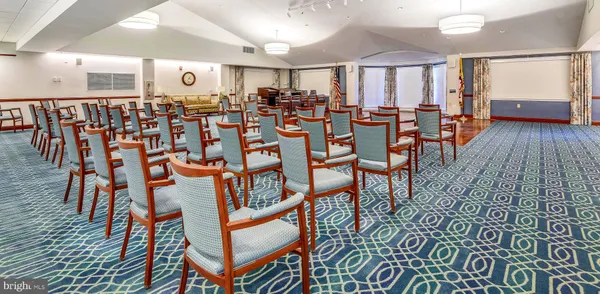 a view of swimming pool with chairs