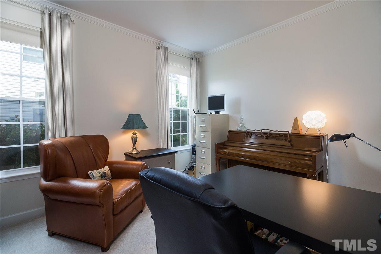5160 Holly Ridge Farm Road Raleigh, NC 27616 - Photo 11 of 25 a living room with furniture and a flat screen tv
