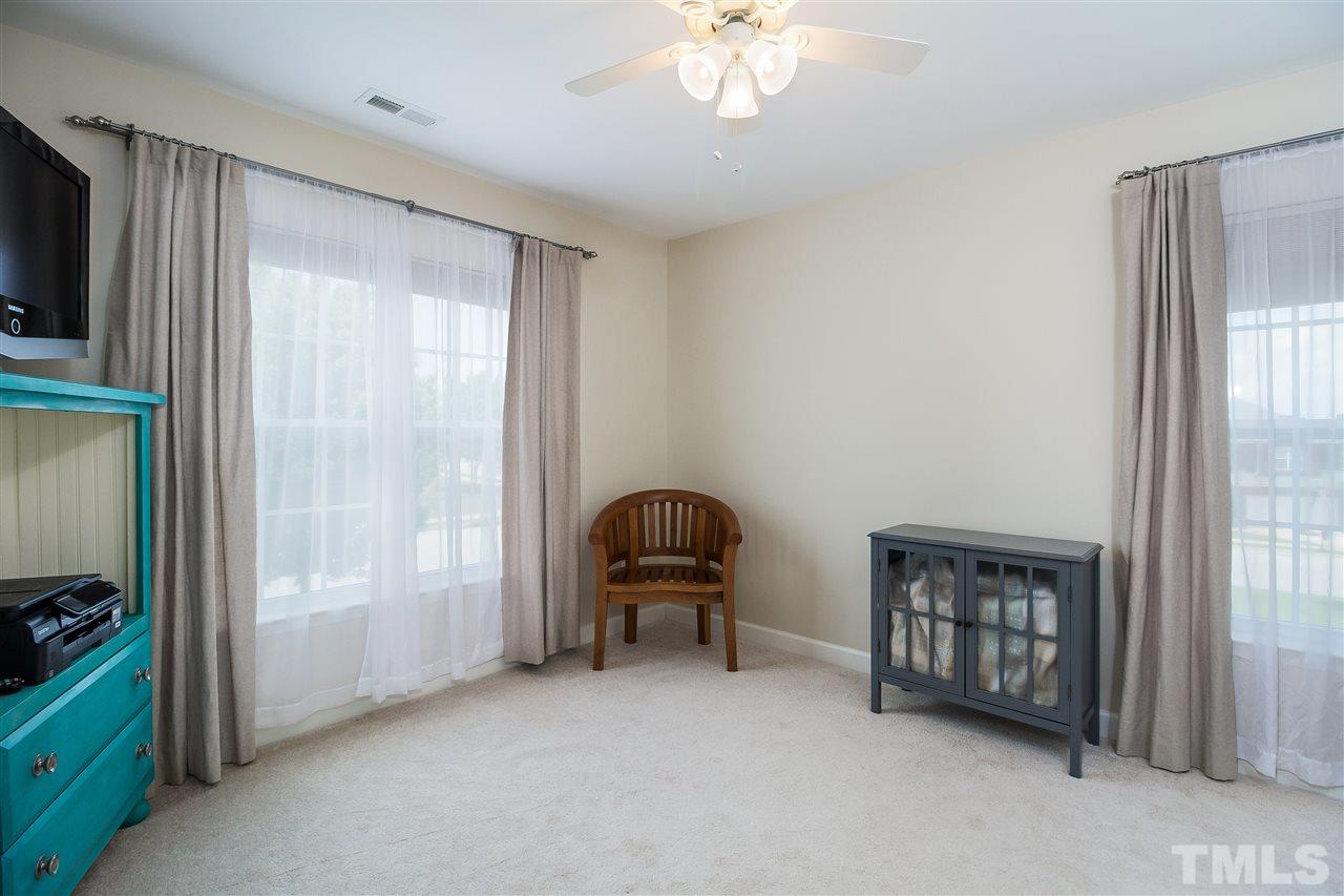 5160 Holly Ridge Farm Road Raleigh, NC 27616 - Photo 14 of 25 a bedroom with furniture and a window