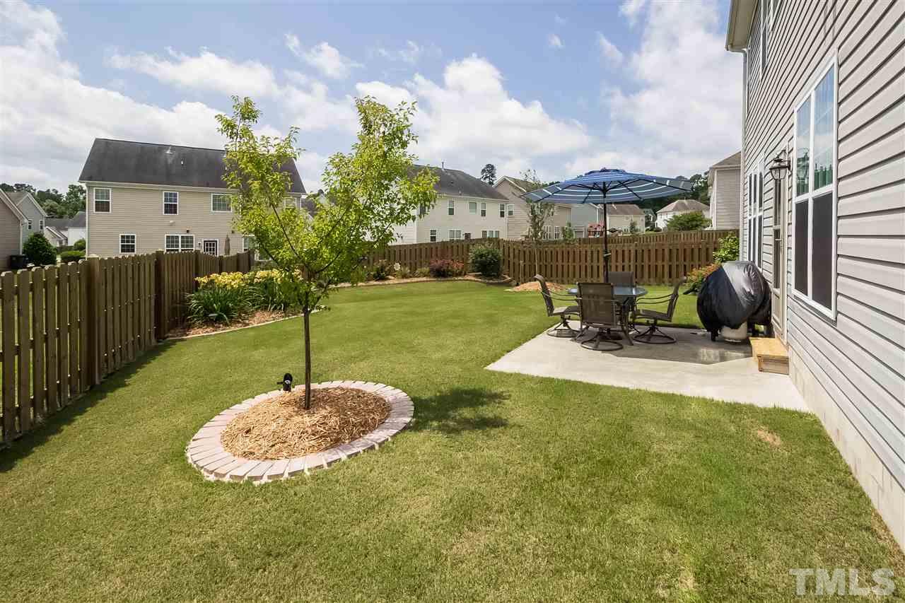 5160 Holly Ridge Farm Road Raleigh, NC 27616 - Photo 20 of 25 a view of a backyard with sitting area