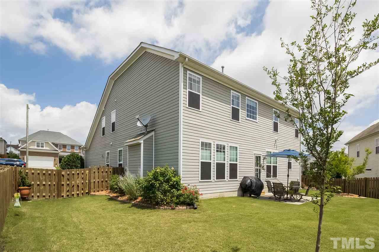 5160 Holly Ridge Farm Road Raleigh, NC 27616 - Photo 21 of 25 a front view of a house with a yard