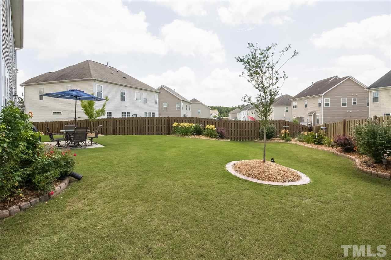 5160 Holly Ridge Farm Road Raleigh, NC 27616 - Photo 22 of 25 a front view of a house with a yard