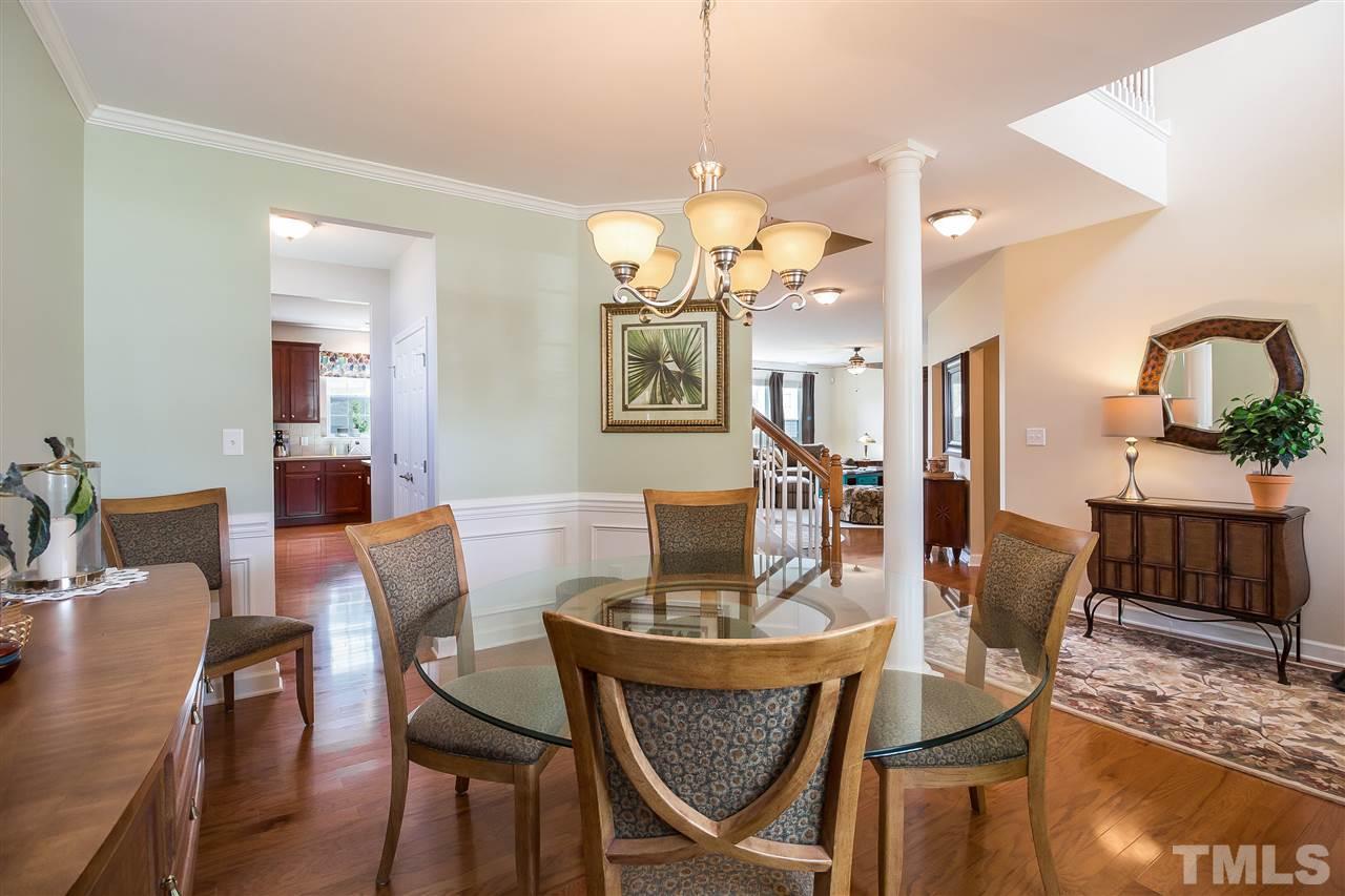 5160 Holly Ridge Farm Road Raleigh, NC 27616 - Photo 7 of 25 a view of a dining room with furniture and wooden floor