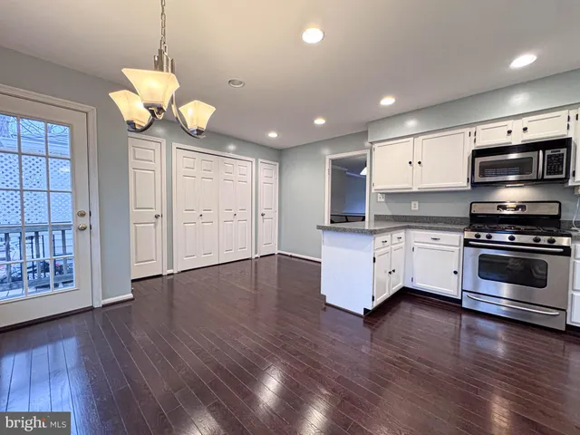 a view of a livingroom with a ceiling fan and window